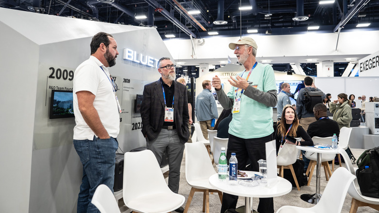 People talking at BLUETTI CES booth