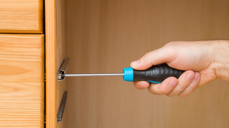 Person adding shelves to closet