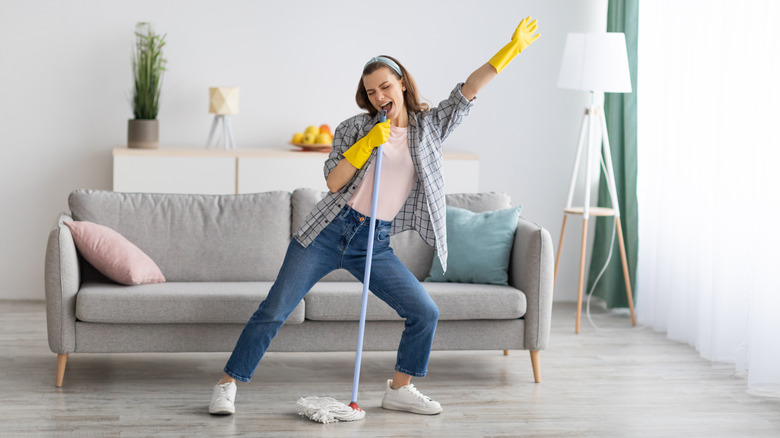 woman singing and cleaning