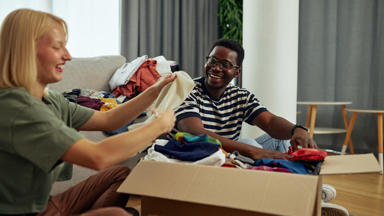 Woman and friend decluttering together