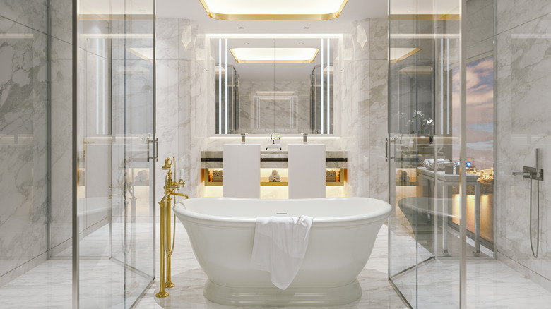 White bathroom with gold accents