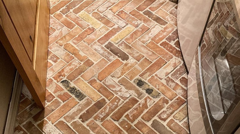 Close up of brick floors installed in a basketweave pattern