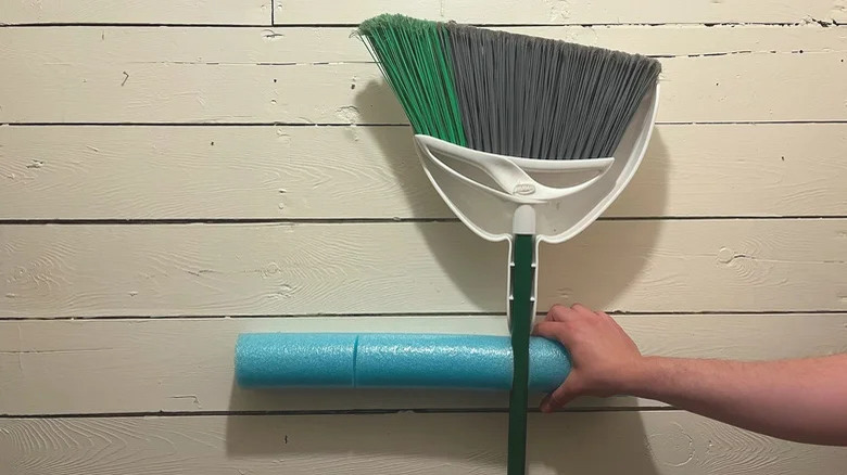 woman storing outdoor broom in foam noodle