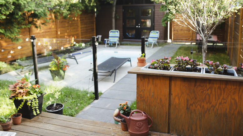 Backyard with chairs and flowerbeds