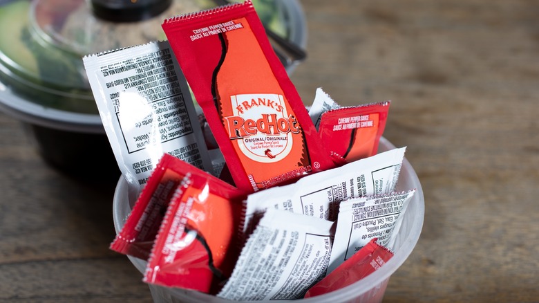 container of sauce packets