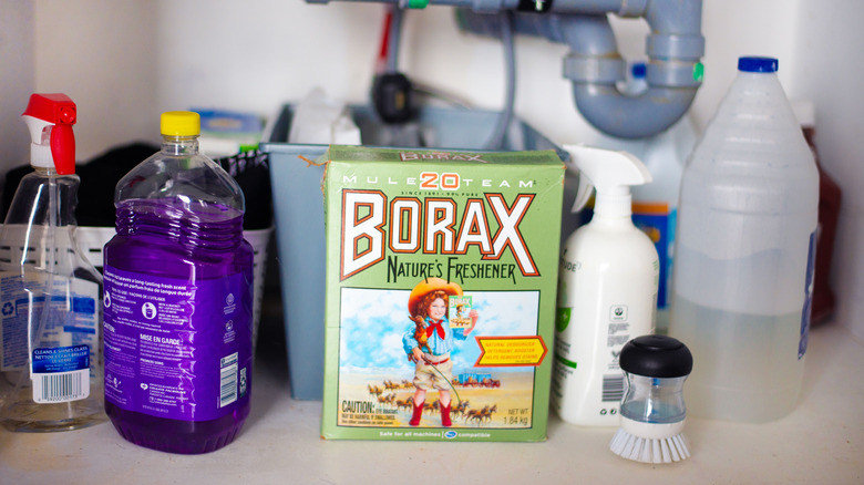 Box of borax with other cleaning products under a sink