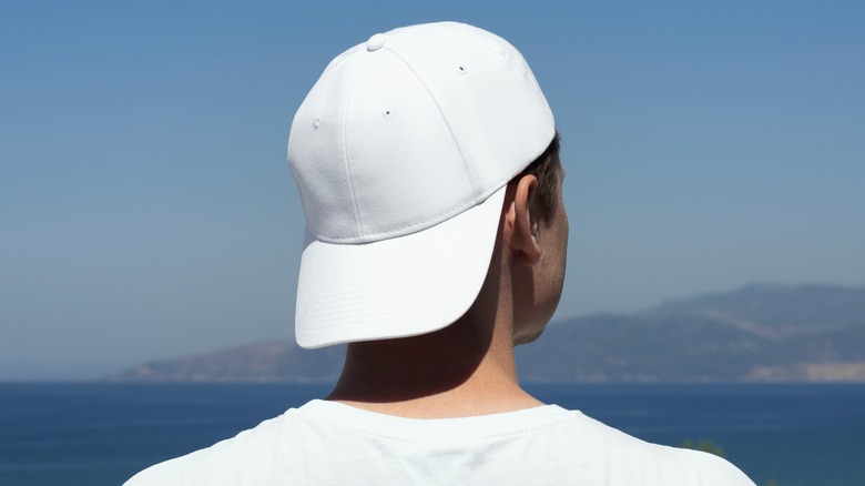 man wearing white baseball cap