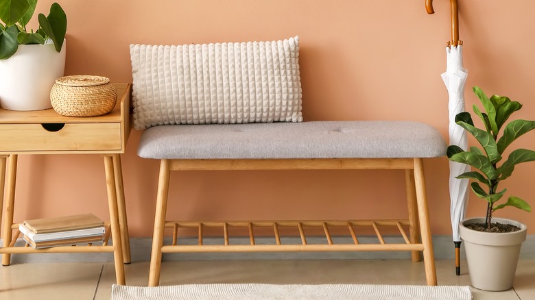 wooden bench with gray cushion