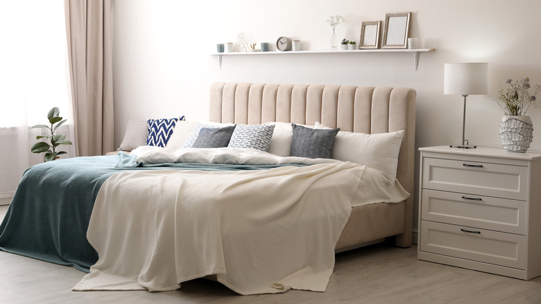 white nightstand in feminine room