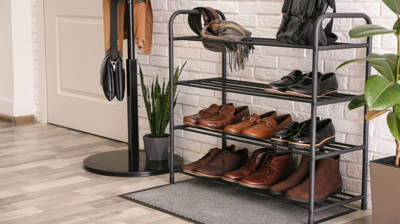 black metal shoe rack hallway