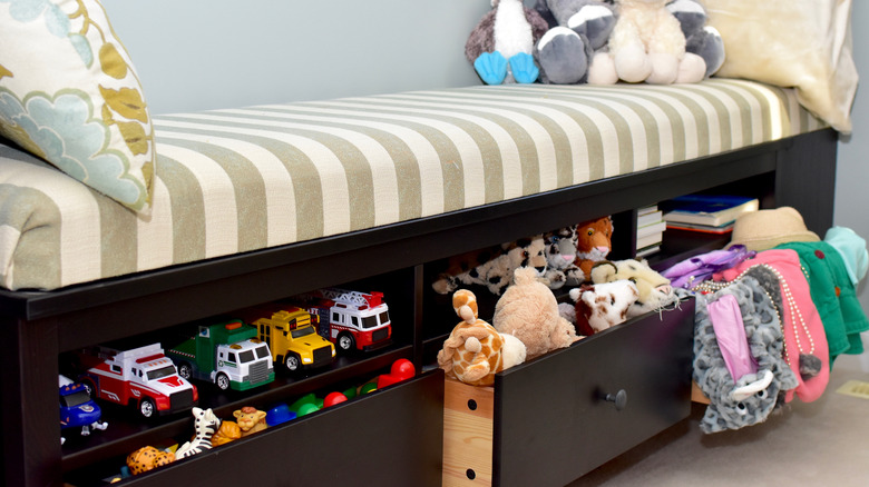 toy box under striped bench