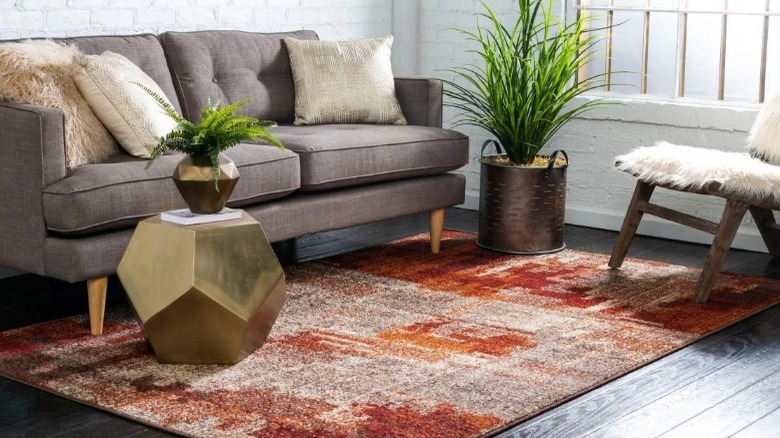 room with red patterned rug and furniture