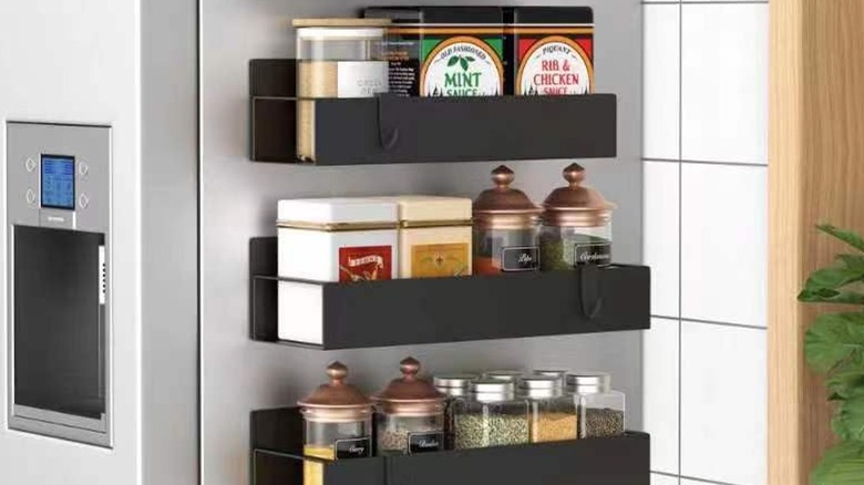 A magnetic spice rack on the side of a refrigerator