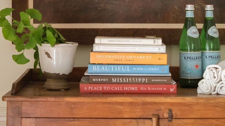 books stacked on counter 