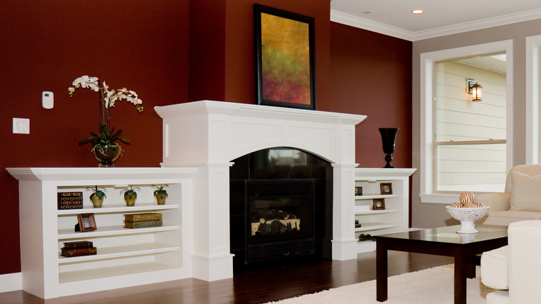 built-in bookshelves next to mantel