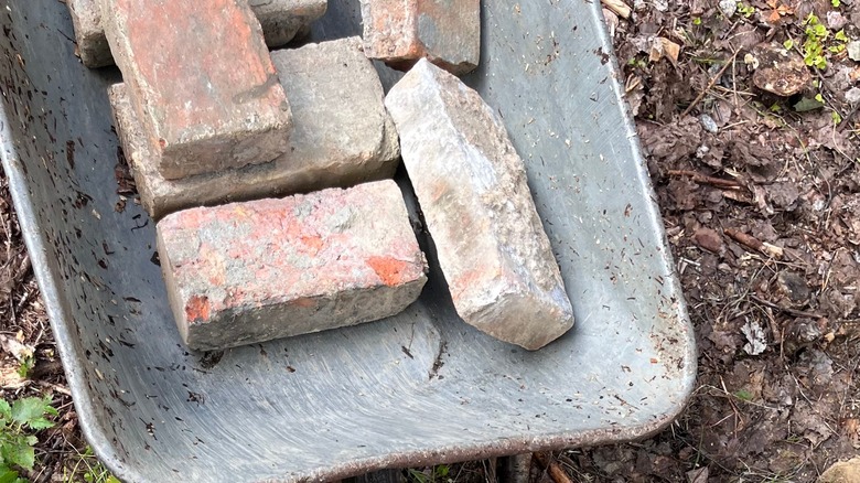 old bricks in a wheelbarrow