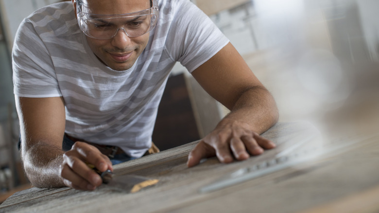 Man building a barnwood countertop