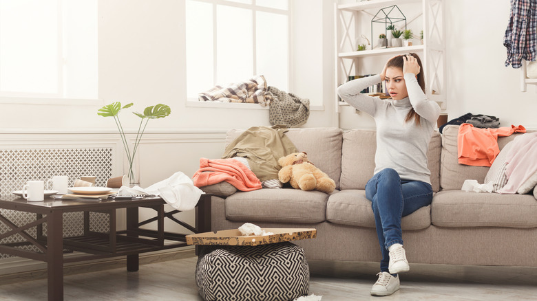 Cluttered coffee table in a woman's living room.