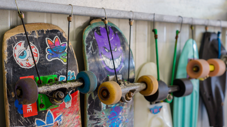 skateboards hanging on bungee cord