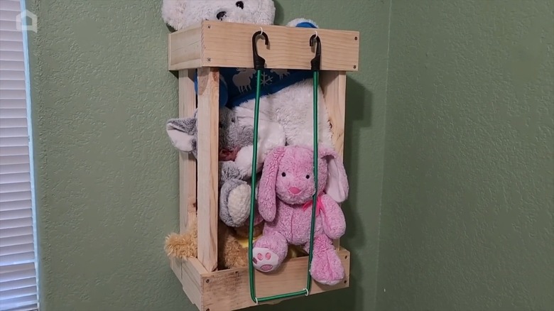 DIY toy cage with bungee cord