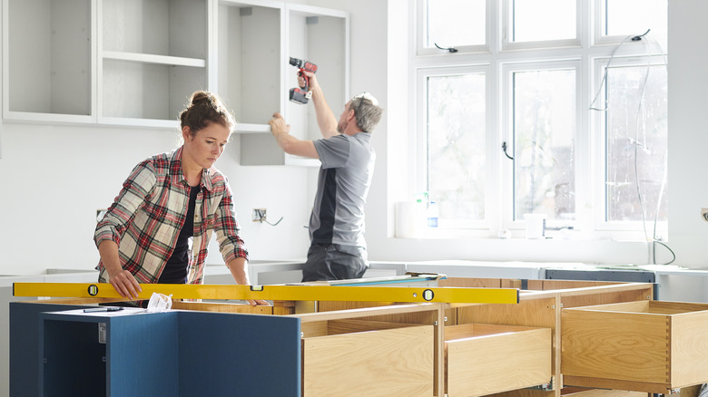 couple doing kitchen construction