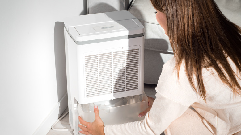 Woman changing humidifier water 