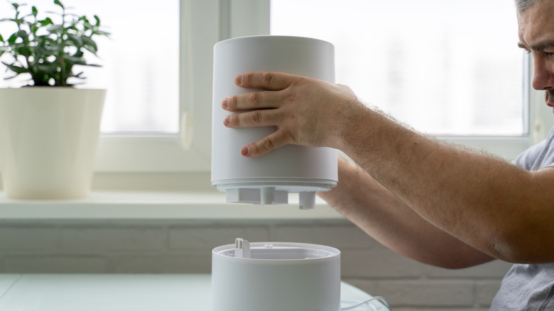 Man takes apart humidifier 