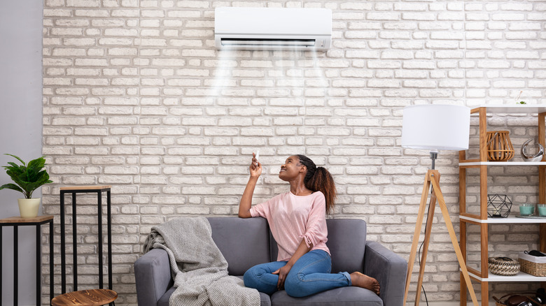 woman enjoying room air conditioner