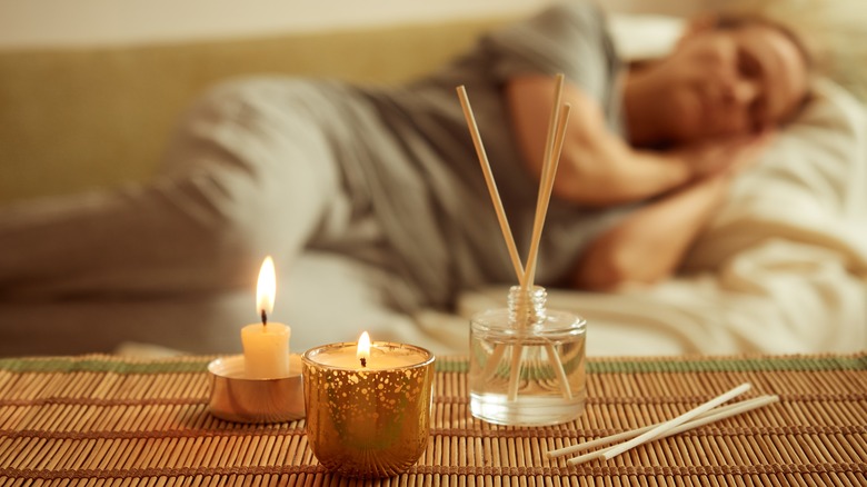 peaceful candles while woman sleeps