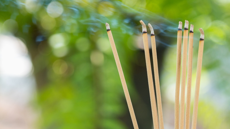 incense sticks burning outside