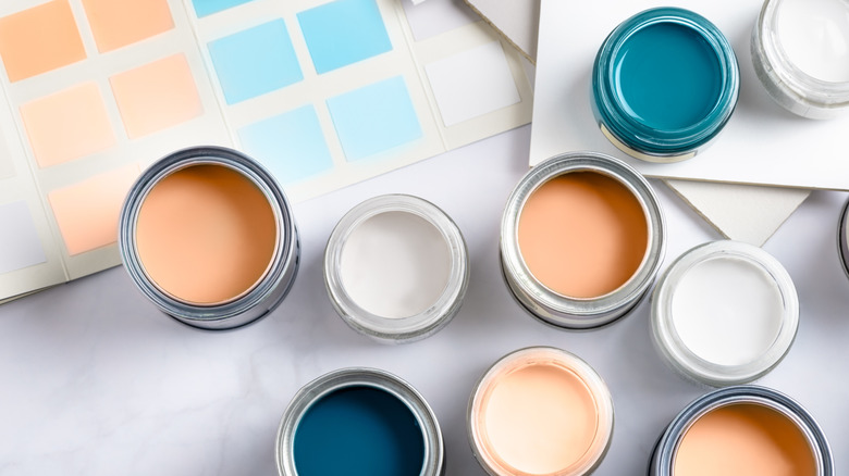 Paint swatches and open cans of paint