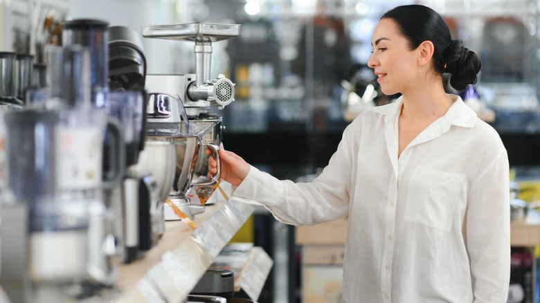 Woman shops for kitchen appliances