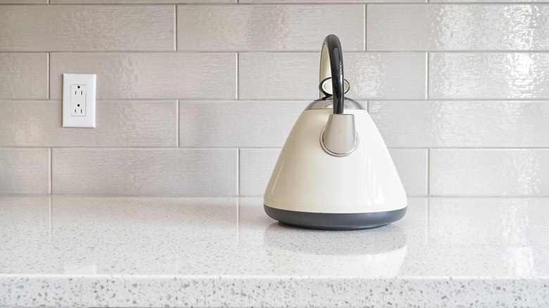 Traditional kettle on granite countertop