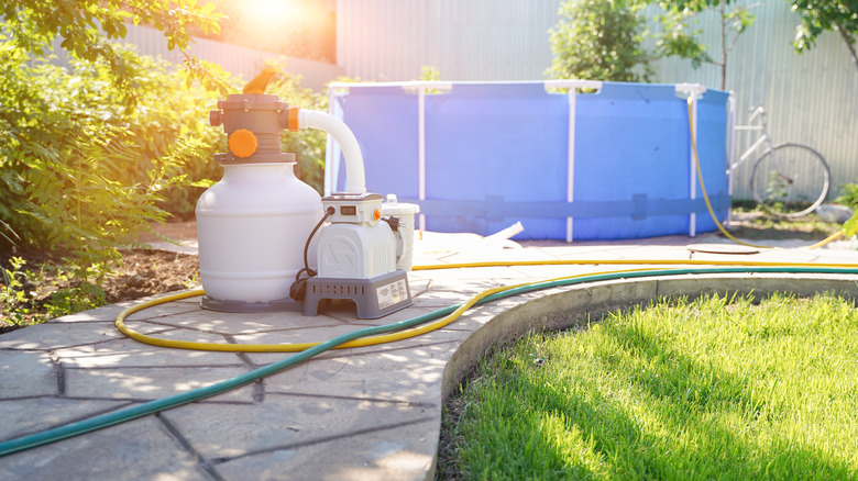 Pump next to swimming pool