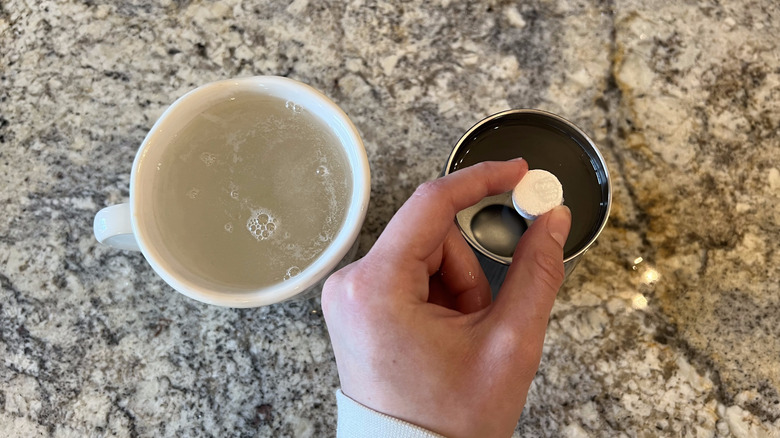 white tablet placed in cup