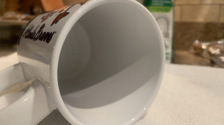 Inside of clean coffee mug on its side