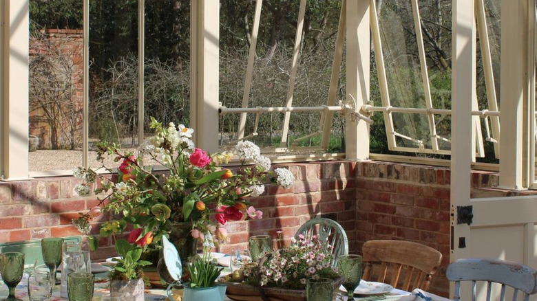 Dining room inside of converted greenhouse