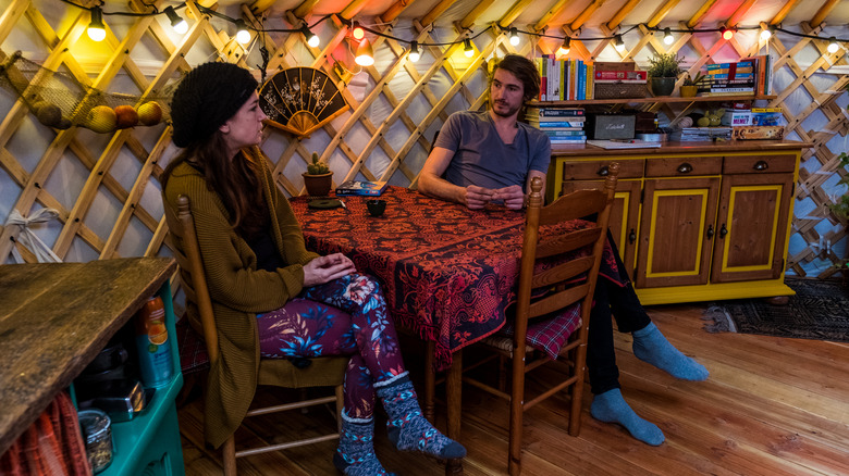 Couple sitting in their yurt