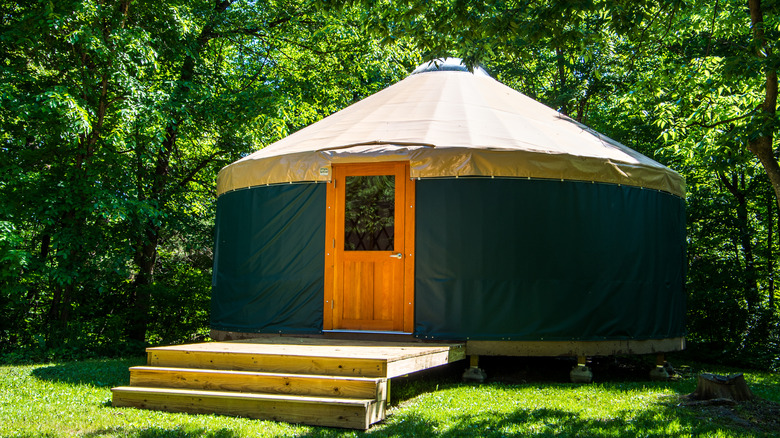 Yurt with posts and wood deck