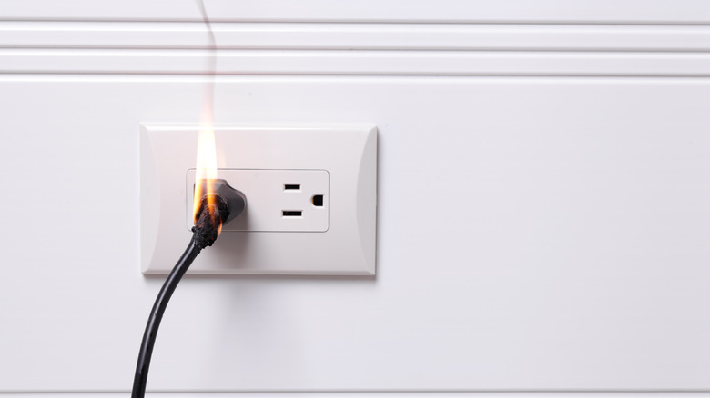 Plugged in cord on fire