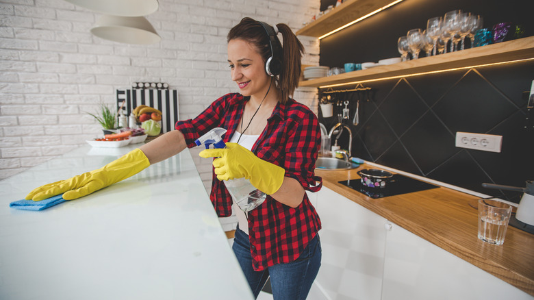 Person cleaning countertop