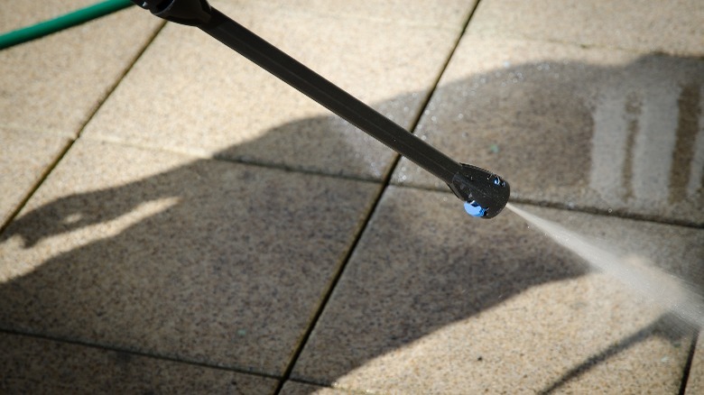 Pressure washer on tile