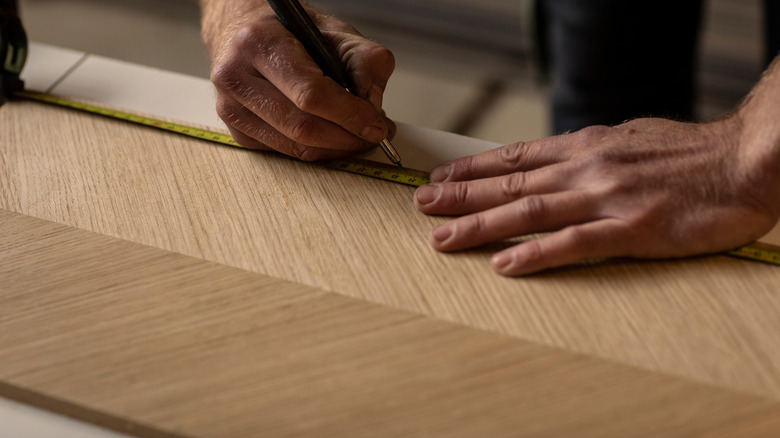 Person working on wood surface