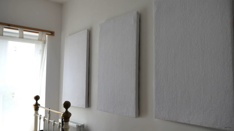 Three sound absorption panels on a wall