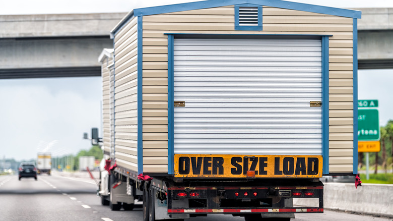 Truck moving a shed