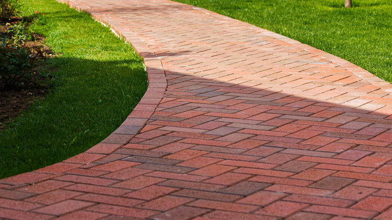 Curving red brick walkway.