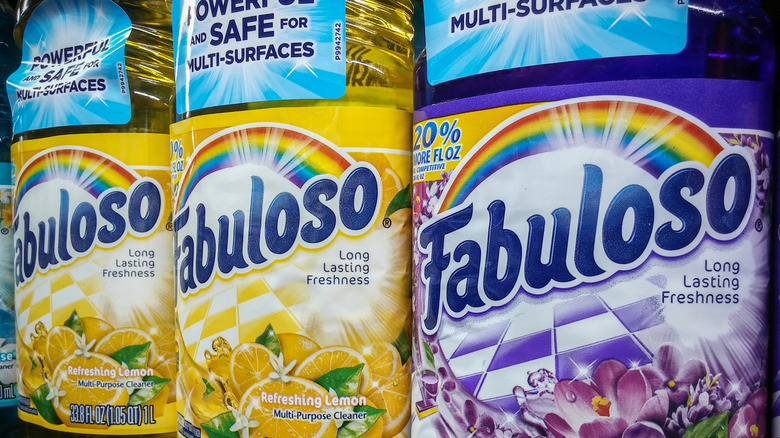 Two bottles of yellow and purple Fabuloso cleaner