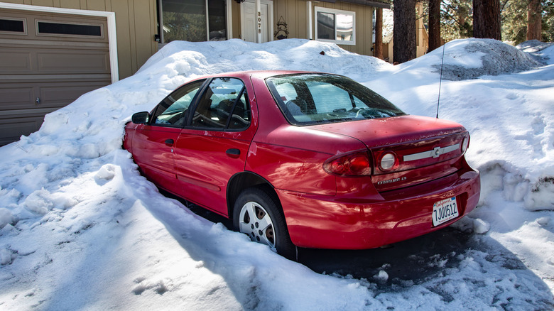Car in snowy driveway