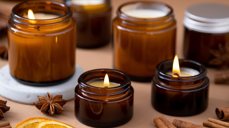 small candles in glass jars