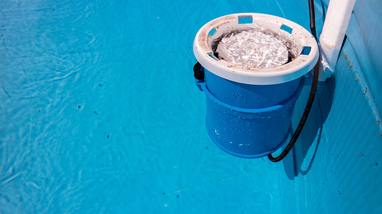 pool filter hanging on side of pool